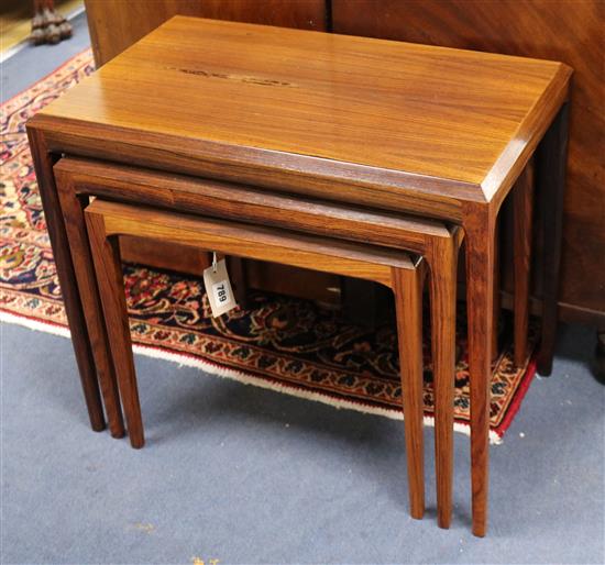 A Johannes Andersen for Silkeborg, Denmark, a nest of three rosewood tea tables, CITES certificate No. 578638/01